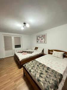 Ένα ή περισσότερα κρεβάτια σε δωμάτιο στο Apartament Comfort