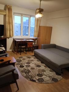 Ένα ή περισσότερα κρεβάτια σε δωμάτιο στο Downtown Studio Apartament