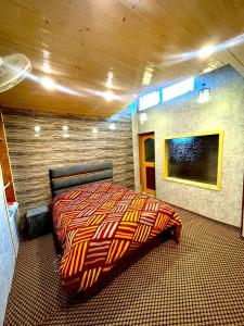 Ένα ή περισσότερα κρεβάτια σε δωμάτιο στο Nature's Resort