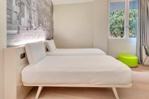 Ένα ή περισσότερα κρεβάτια σε δωμάτιο στο B&B Hotel Bergamo City