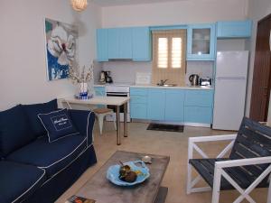 A kitchen or kitchenette at Melograno Apartments and Studios