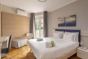 Postel nebo postele na pokoji v ubytování B&B Hotels Park Hotel Suisse Santa Margherita Ligure