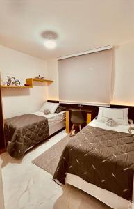 Ένα ή περισσότερα κρεβάτια σε δωμάτιο στο Alto Padrão e Tranquilidade no Litorial Norte +17 φωτογραφίες