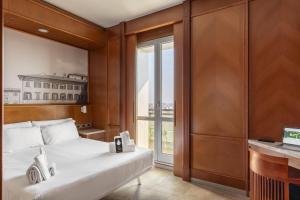 Ένα ή περισσότερα κρεβάτια σε δωμάτιο στο B&B Hotel Modena