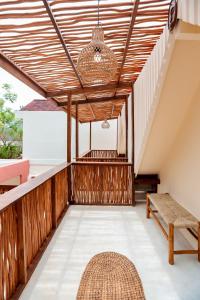 En eller flere senge i et værelse på Villa Qetzia