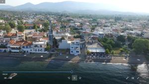 an aerial view of a town next to the water at Maria's apt in Amarynthos