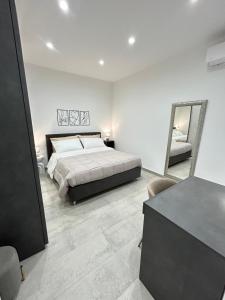 Ένα ή περισσότερα κρεβάτια σε δωμάτιο στο Mongibello Apartment +18 φωτογραφίες
