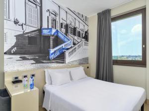 Ένα ή περισσότερα κρεβάτια σε δωμάτιο στο B&B Hotel Milano-Monza