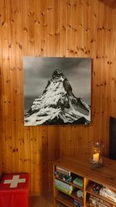 a black and white picture of a mountain on a wall at Chalet Valdonga in Flumserberg