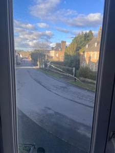 a view of an empty street from a window at Tinchebray in Tinchebray