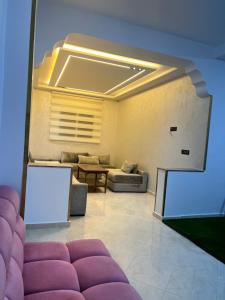 a living room with a couch and a table at Dar diyafa kannoua in Tangier