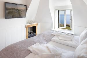 Ένα ή περισσότερα κρεβάτια σε δωμάτιο στο Seaside