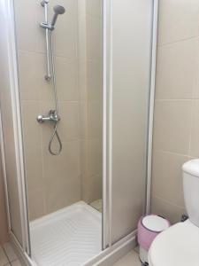 a shower stall in a bathroom with a toilet at A Home at Coralli - Protaras Beach Apartment, 30 m from beach in Protaras +26 photos
