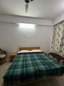 Ένα ή περισσότερα κρεβάτια σε δωμάτιο στο Doongri Haveli