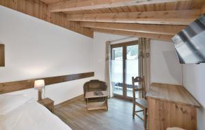 Una cama o camas en una habitación de Le Chamois