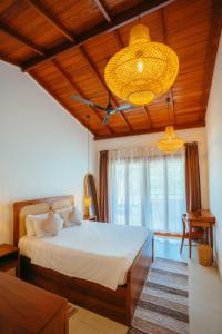 Ένα ή περισσότερα κρεβάτια σε δωμάτιο στο Casa Tharin Madiha