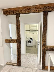 a view of a bathroom from the hallway of a house at Monteurzimmer Renix Heilbronn in Brackenheim