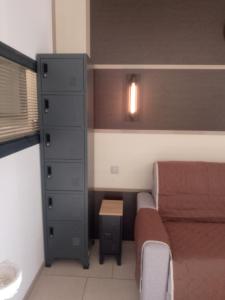 a small bedroom with a bed and a dresser at ANTIQUA ROMA - via temporis CXIV in Alénya