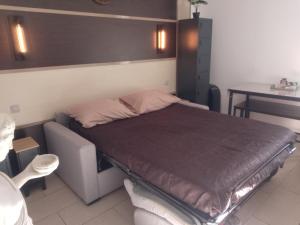 Ένα ή περισσότερα κρεβάτια σε δωμάτιο στο ANTIQUA ROMA - via temporis CXIV