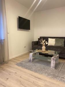 Et tv og/eller underholdning på Modernes Apartment in der Nähe zum Casino