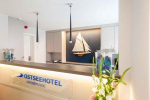 a museum with a model of a boat on a counter at Ostseehotel Warnemünde in Warnemünde