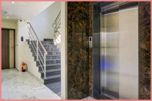 un pasillo con escalera y ascensor de metal en Chakra Tirtha Road Moon Rise Residency Near Jagannath Temple And Fully Air conditione-# Free Wifi And Room Service #Budget Class Best Hotel IN Puri, en Puri