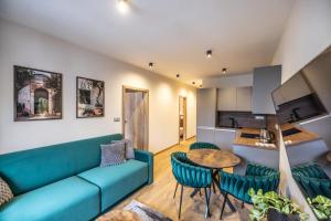 Un televizor și/sau centru de divertisment la G&T Square Apartments