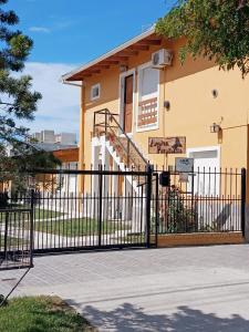a black gate in front of a house at Amien Patagonia in Puerto Madryn +23 photos