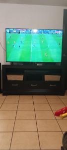 a flat screen tv sitting on top of a table at Cuarto 1 in Cuautitlán Izcalli +2 photos