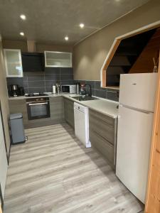 Kuchyň nebo kuchyňský kout v ubytování Le Havre de Bois