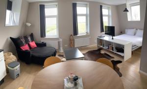 Ένα ή περισσότερα κρεβάτια σε δωμάτιο στο Zeeziek