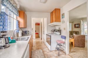 a kitchen with a sink and a counter at Cannons Cottage in Cannon Beach