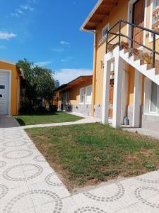 a walkway in front of a building at Amien Patagonia in Puerto Madryn