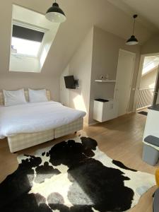 Ένα ή περισσότερα κρεβάτια σε δωμάτιο στο Zeeziek