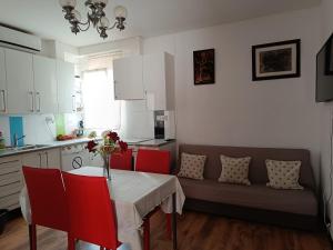 a living room with a table and a couch at Burriana in Burriana