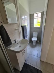 Ванная комната в BLISS Cottage Langenhovenpark