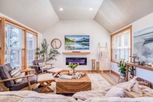 a living room with a couch and a fireplace at Sunshine and Sweaters in Pacific City