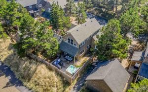 an aerial view of a house with a pool at Sunshine and Sweaters in Pacific City