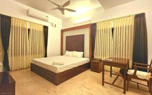 Ένα ή περισσότερα κρεβάτια σε δωμάτιο στο Sandra Suite Ranga illam