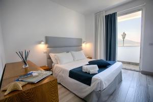 A bed or beds in a room at Relais Manfredi