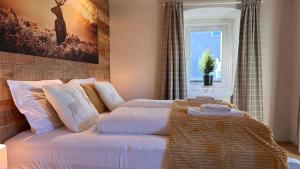 En eller flere senge i et værelse på Landhaus Vorderberg - Appartementen