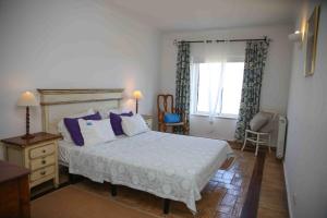 a bedroom with a large bed and a window at Belver Porto Dona Maria Resort in Luz +97 photos