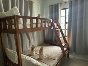 Ένα ή περισσότερα κρεβάτια σε δωμάτιο στο Elegant House 2-BR at Dahican Mati with Free Wi-Fi +14 φωτογραφίες