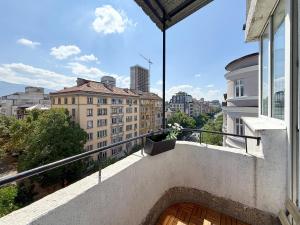 a balcony with a view of a city at Heart of Sofia 2 Bdr Elevator Balcony Relax in Sofia +21 photos
