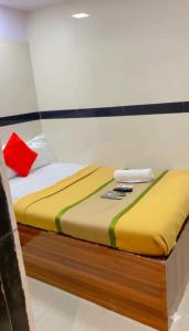 En eller flere senge i et værelse på Hotel Angels Inn By Glitz Hotels