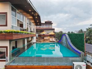 an image of a swimming pool at a hotel with a slide at Beach Corridor Hotel & Spa with Free Airport shuttle in Negombo
