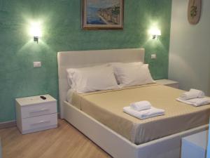 Postel nebo postele na pokoji v ubytování Guest House Le Tre Spezie