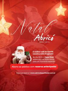un prospectus de Noël avec le père Noël prenant une photo dans l'établissement Abricó Beach Hotel, à São Sebastião