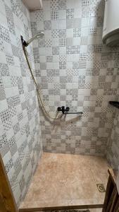a bathroom with a shower with a tiled wall at Old farm 1 in Ijevan +19 photos