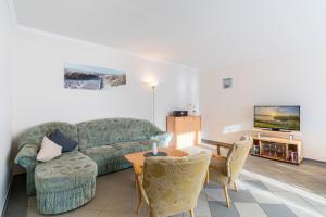 TV a/nebo společenská místnost v ubytování Ferienwohnungen Kienast